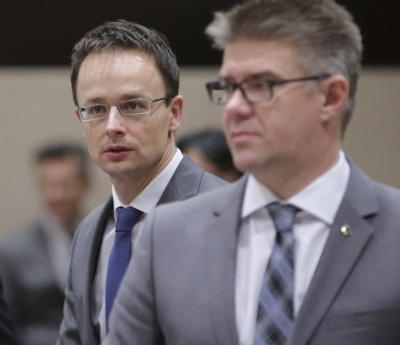 epa04512802 Hungarian Minister of Foreign Affairs and Trade Peter Szijjarto (L) and Foreign Minister of Iceland Gunnar Bragi Sveinsson attend an international Counter-IS (Islamic State) Coalition meeting at Nato headquarters in Brussels, Belgium, 03 December 2014. Ministers from almost 60 countries that have formed a coalition against the extremist Islamic State militia group will review their efforts, at talks in Brussels chaired by US Secretary of State John Kerry. The talks are taking place at NATO's headquarters in Brussels, a day after many of the ministers attended a meeting of the military alliance. NATO is not involved in the coalition. EPA/OLIVIER HOSLET +++(c) dpa - Bildfunk+++