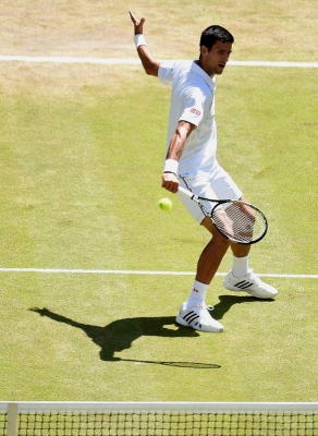 Novak Djokovic of Serbia in action against Richard Gasquet of France during their semi final match for the Wimbledon Championships at the All England Lawn Tennis Club, in