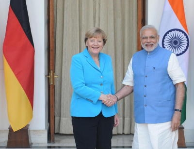 Indian Prime Minister Narendra Modi (C) and German Chancellor Angela Merkel (R) during their visit to Bosch facility in Bangalore, India on 06 October 2015.