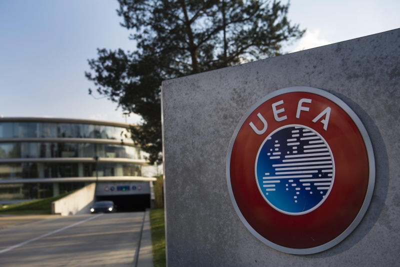 ARCHIV - epa05246659 The UEFA logo is pictured next to the entrance of the UEFA Headquarters, in Nyon, Switzerland, 06 April 2016.