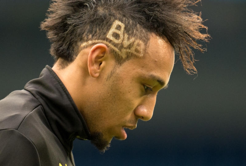 <p>Spanien, Madrid: Borussia Dortmund Pierre-Emerick Aubameyang trainiert im Estadio Santiago Bernabeu. In seiner Frisur ist der Schriftzug «BVB» zu lesen. Der BVB trifft am 02.04.2014 im Viertelfinal-Hinspiel der UEFA Champions League auf Real Madrid.</p>