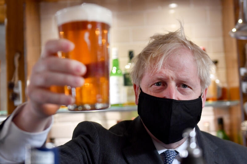 <p>Boris Johnson, Prime Minister of UK, with a beer</p>